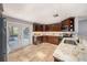 Updated kitchen with custom cabinets, stainless appliances, granite countertops, and backyard access at 1513 Owen Dr, Clearwater, FL 33759