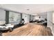 Bright living room with hardwood floors, comfortable seating, and ample natural light at 1513 Owen Dr, Clearwater, FL 33759