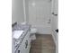Bathroom featuring a shower-tub combination, granite vanity top, and modern fixtures at 1537 Palmetto St, Clearwater, FL 33755