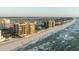 Aerial view of beachfront condo buildings along the coastline with ocean views at 1600 Gulf Blvd # 618, Clearwater, FL 33767
