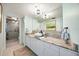 Bright bathroom features granite countertops, modern lighting, and a large walk-in shower at 1600 Gulf Blvd # 618, Clearwater, FL 33767