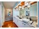 Spacious bathroom featuring a double vanity, a soaking tub, and access to the walk-in closet at 1600 Gulf Blvd # 618, Clearwater, FL 33767