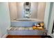 Modern bathroom bathtub with tile surround and marble accents at 1600 Gulf Blvd # 618, Clearwater, FL 33767
