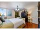 Comfortable bedroom with wicker frame, plantation shutters, and wood flooring at 1600 Gulf Blvd # 618, Clearwater, FL 33767