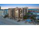 Aerial view of the oceanfront high rise condominium building with palm trees and a pool at 1600 Gulf Blvd # 618, Clearwater, FL 33767