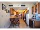 Bright kitchen featuring a bar area with two stools, stainless steel appliances, and granite countertops at 1600 Gulf Blvd # 618, Clearwater, FL 33767