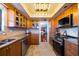 Modern kitchen featuring stainless steel appliances, tile backsplash, and ample cabinet space at 1600 Gulf Blvd # 618, Clearwater, FL 33767