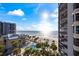 Beautiful ocean view and resort-style pool with lush palm trees at this beachfront property at 1600 Gulf Blvd # 618, Clearwater, FL 33767