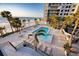 Relaxing poolside with palm trees, lounge chairs and beach access for ultimate vacation living at 1600 Gulf Blvd # 618, Clearwater, FL 33767