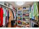 Walk-in closet with wood floors, shelving and ample hanging storage space at 1600 Gulf Blvd # 618, Clearwater, FL 33767