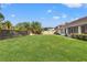 Large, well-kept backyard with a sturdy wooden fence, offering privacy and a great space at 1608 Ledgestone Dr, Brandon, FL 33511