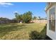 The backyard is spacious with a sturdy wooden fence that offers a private outdoor living space at 1608 Ledgestone Dr, Brandon, FL 33511