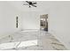 Large bedroom offers bright light with sliding doors to lanai, and marble flooring at 1608 Ledgestone Dr, Brandon, FL 33511
