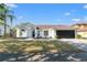 Charming single Gathering home with manicured lawn, attached garage, and white exterior paint at 1608 Ledgestone Dr, Brandon, FL 33511