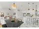 Open-concept living area featuring a modern kitchen, cozy living room, and a stylish dining space at 1608 Ledgestone Dr, Brandon, FL 33511