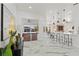 Open-concept living area featuring marble flooring, modern decor, and a view of the outdoor lanai at 1608 Ledgestone Dr, Brandon, FL 33511