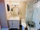 Contemporary bathroom featuring a marble-look glass shower, modern vanity, and updated fixtures at 18228 Paradise Point Dr, Tampa, FL 33647