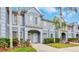 Charming townhouse with well-manicured landscaping, private entrance, and neutral-toned exterior at 18228 Paradise Point Dr, Tampa, FL 33647