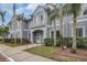 Inviting condo exterior featuring palm trees, lush greenery, and a well-kept facade at 18228 Paradise Point Dr, Tampa, FL 33647