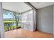 Charming, enclosed lanai with tiled floor and view of pond and golf course at 18228 Paradise Point Dr, Tampa, FL 33647