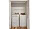 Bright laundry room featuring a modern washer and dryer and wire shelving at 18228 Paradise Point Dr, Tampa, FL 33647