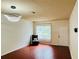 Inviting living room featuring wood floors, a chair, and a bright window at 18228 Paradise Point Dr, Tampa, FL 33647