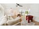 Bright living room featuring a plush sofa, modern decor, and an open layout connecting to the kitchen at 1886 San Mateo Dr, Dunedin, FL 34698