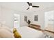 Cozy main bedroom with wood floors, bench seating, and an en-suite bathroom at 1886 San Mateo Dr, Dunedin, FL 34698