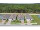 An aerial view of several homes showcasing well-manicured lawns and tree lined streets at 19629 Fort King Run, Brooksville, FL 34601