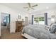 Relaxing bedroom offers natural light, dresser, and decor with a beachy, tranquil style at 19629 Fort King Run, Brooksville, FL 34601