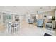 Large common area with seating, tables, and natural light, providing a versatile space for residents at 19629 Fort King Run, Brooksville, FL 34601