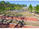 A bocce ball court with the community pool and clubhouse in the background at 19629 Fort King Run, Brooksville, FL 34601