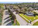 The beautiful community entrance features manicured landscaping and mature trees at 19629 Fort King Run, Brooksville, FL 34601