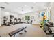 Spacious fitness center equipped with treadmills, weights, and exercise machines for a complete workout at 19629 Fort King Run, Brooksville, FL 34601