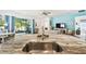 Close-up of a kitchen island featuring a sink and barstool seating, offering a view into the living room at 19629 Fort King Run, Brooksville, FL 34601