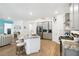Open-concept kitchen with a center island, stainless steel appliances, and seamless flow to the living area at 19629 Fort King Run, Brooksville, FL 34601
