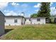 Spacious backyard featuring a well-manicured lawn and lush landscaping at 1979 E Skyline Dr, Clearwater, FL 33763