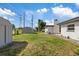 Spacious backyard featuring two storage sheds at 1979 E Skyline Dr, Clearwater, FL 33763