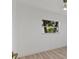 Bright bedroom featuring neutral-toned walls, a window, and a ceiling fan at 1979 E Skyline Dr, Clearwater, FL 33763