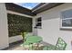 Charming patio area with a decorative green wall, perfect for relaxing outdoors at 1979 E Skyline Dr, Clearwater, FL 33763