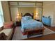 Cozy bedroom with a beach-themed decor, comfortable bed, and soft lighting at 20903 Amanda Oak Ct, Land O Lakes, FL 34638