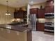 Well-appointed kitchen features stainless steel appliances and a center island at 20903 Amanda Oak Ct, Land O Lakes, FL 34638