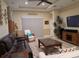Comfortable living room featuring a ceiling fan and modern furniture at 20903 Amanda Oak Ct, Land O Lakes, FL 34638