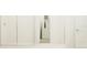 Modern bathroom with tile shower and open closet at 22075 Storybook Cabin Way, Land O Lakes, FL 34637