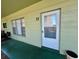 The unit's front door features a screen door and is painted white; the unit number is clearly displayed as '17' at 2459 Columbia Dr # 17, Clearwater, FL 33763