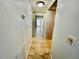 Hallway with tile flooring that leads to the living room, offering a glimpse of the natural light inside at 2459 Columbia Dr # 17, Clearwater, FL 33763