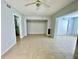 Open living room with ceiling fan, neutral walls and tile flooring offers flexibility and comfort for any decor at 2459 Columbia Dr # 17, Clearwater, FL 33763