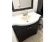 Updated bathroom vanity with a white countertop, dark cabinetry, and a modern faucet at 2625 State Road 590 # 1822, Clearwater, FL 33759