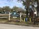 Coachman Creek Condominiums community sign with manicured landscaping at 2625 State Road 590 # 1822, Clearwater, FL 33759