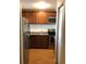 Open concept kitchen with new appliances, updated cabinets and laminate flooring at 2625 State Road 590 # 1822, Clearwater, FL 33759
